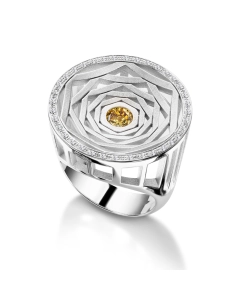 Anello in oro bianco tit. 750/000 con diamante fancy trattato centrale taglio brillante, per ct. 0,60 e diamanti laterali taglio